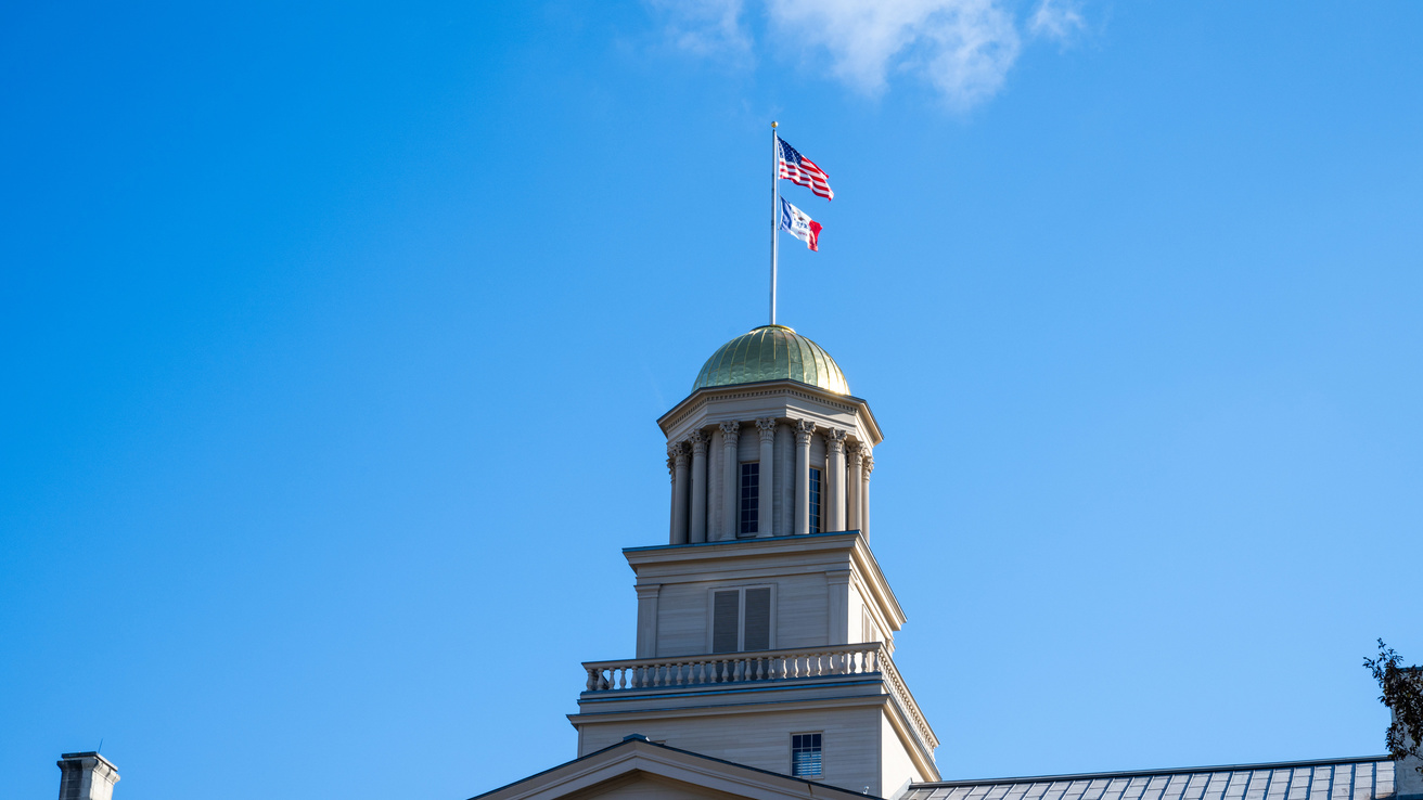 American flag flies over the Pentacrest